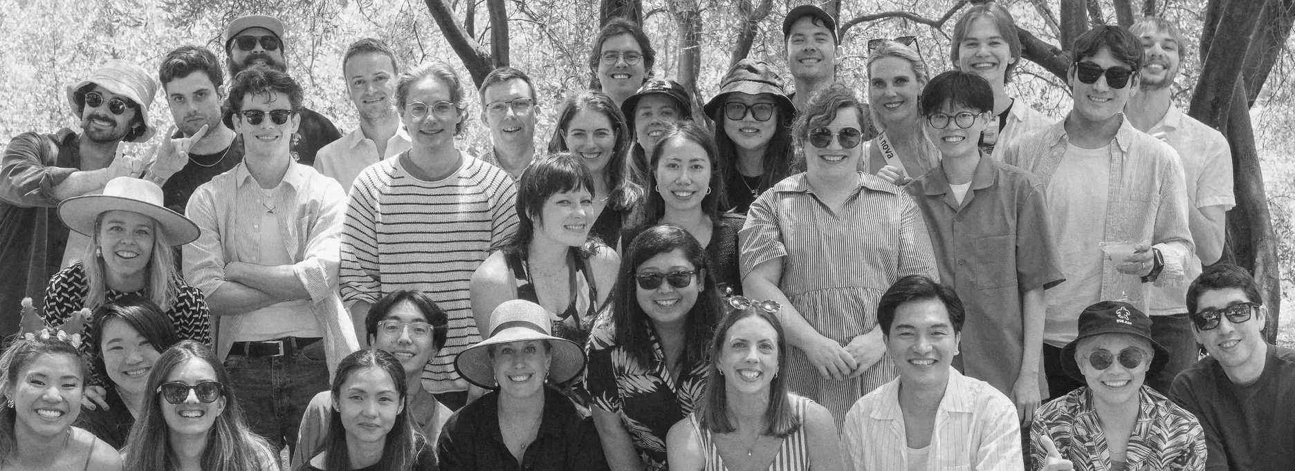 Black and white photo of team at outdoor event